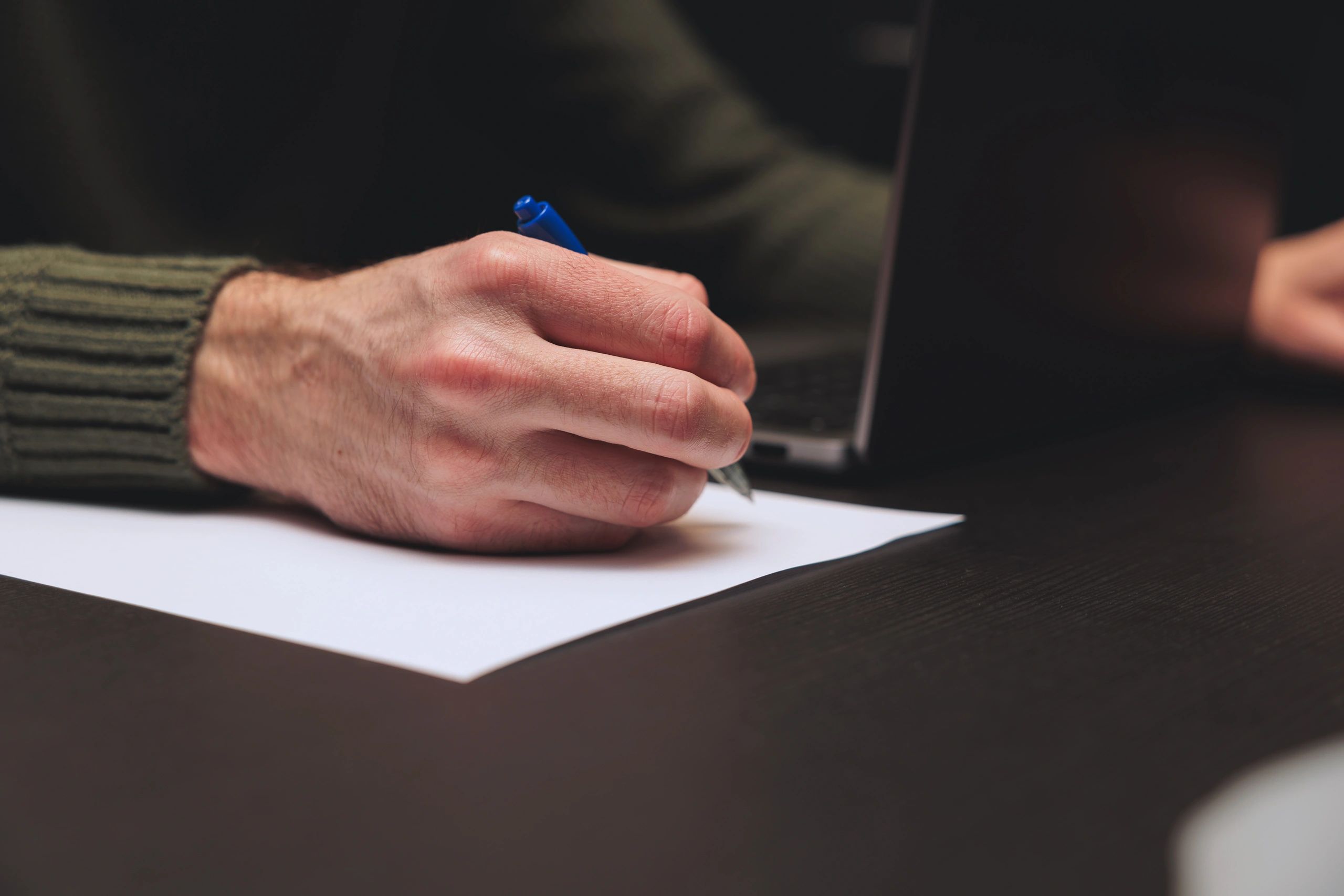 Business professional reviewing documents at a desk